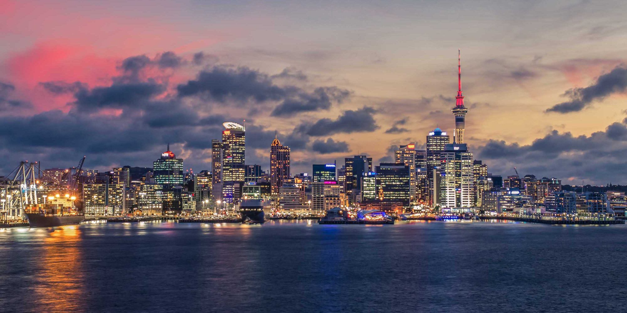 Auckland city with dramatic sunset sky